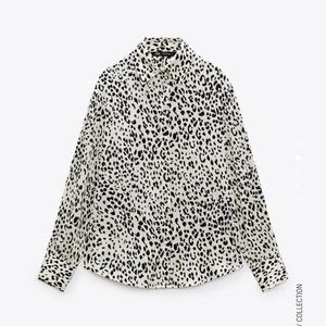 Lapel collar, long sleeve animal print blouse. New with tags. Polyester material